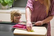 Child looking at Mum packing lunch in a Stainless Bento Lunchbox 
