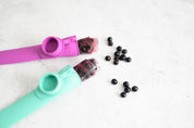 teal and purple reuseable ice block moulds with iced berry block and blueberries from CaliWoods